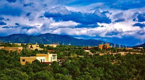Landscape with houses with lots of clouds in Santa Fe, Clouds free photo