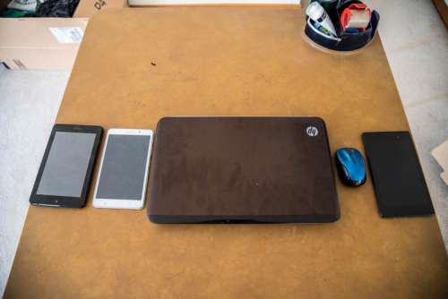 Laptop and Tablet a full workbench free photo