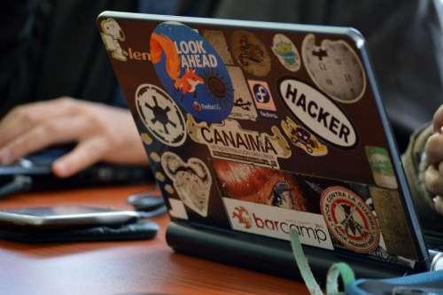 Laptop with a lot of stickers free photo