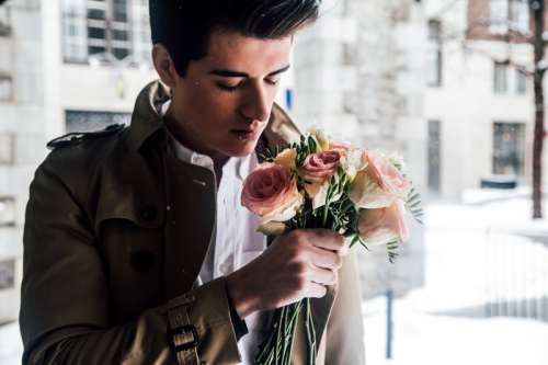Man Smelling Roses on Valentine's Day free photo