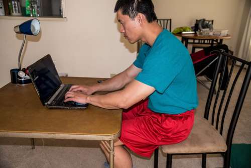 Man working on laptop free photo