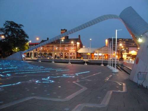 Millennium Square by night, showing the Time Zone Clock in Coventry, England free photo