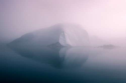 Misty Iceberg on the Sea in Greenland free photo