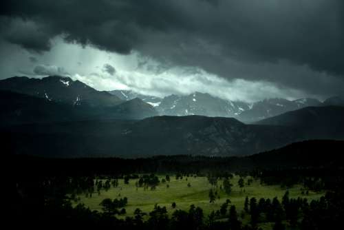 Mountain and forest landscape in Colorado under stormy skies free photo
