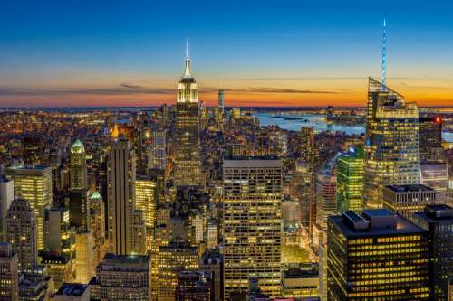 New York Cityscape with lighted up Skyscrapers  free photo