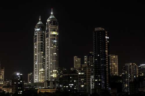 Night skyscrapers with lights in Mumbai, India free photo