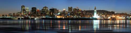 Night Time Skyline with towers and buildings over the water in Montreal, Quebec free photo