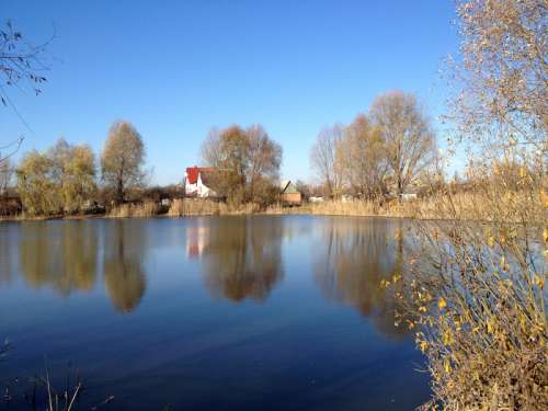 Pond and Houses landscape in Ukraine free photo