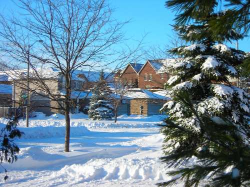Residential condominiums and houses in Barrie after a snowfall in Barrie, Ontario, Canada free photo