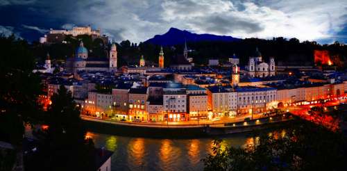 Riverfront lights and cityscape in Salzburg, Austria free photo