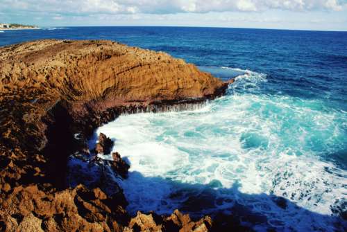 Rocky shoreline and waves in Puerto Rico free photo