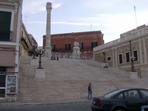 Roman column marking the end of the ancient Via Appia in Brindisi, Italy free photo