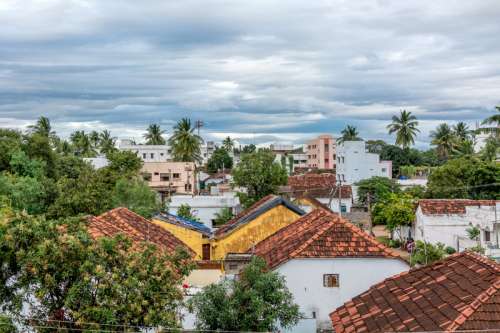 Rooftops view with clouds in a village in India free photo
