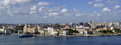 Skyline and cityscape under sky and clouds in Havana, Cuba free photo