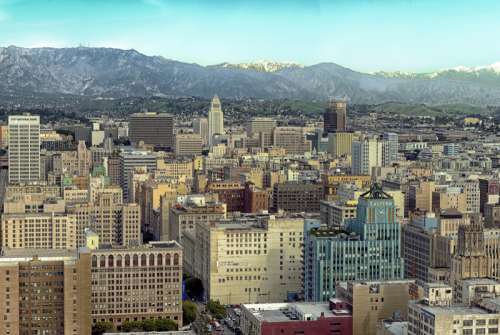 Skyline of Los Angeles with Mountains in the Background, California free photo