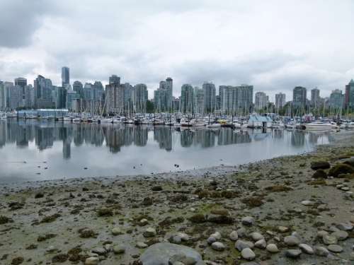Skyline of Vancouver across the water with boats in British Columbia, Canada free photo