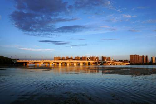 Skyline of Wuxi across the lake in Jiangsu, China free photo