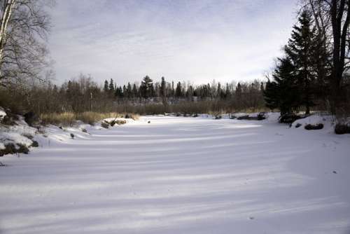 Snowy River Landscape with trees and sky at Gooseberry Falls State Park, Minnesota free photo
