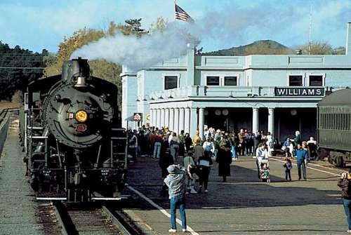 Steam locomotive and train sitting at Williams Depot in Arizona free photo