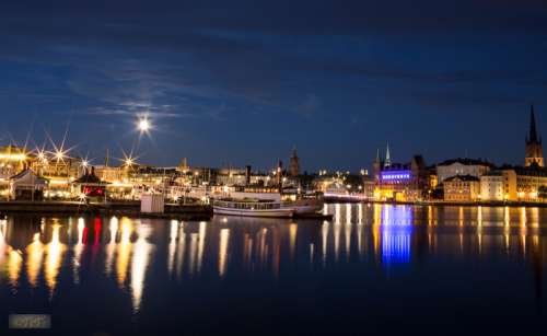 Stockholm, lighted city at night free photo