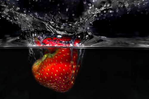 Strawberry Plunging into Water free photo
