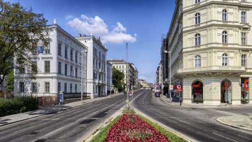 Street View with buildings and road in Vienna, Austria free photo
