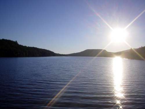 Sun over Christine Lake in Shark, New Hampshire free photo