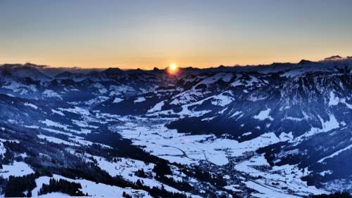 Sunrise over the snowy Alps landscape free photo