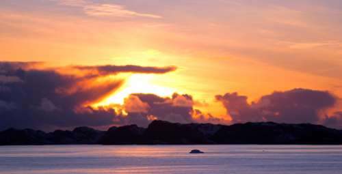 Sunset Beyond the clouds in Greenland free photo