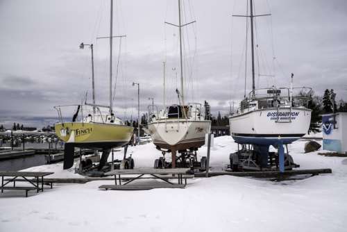 Three Boats at the Marina in the winter in Grand Marais, Minnesota free photo