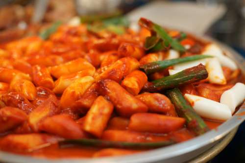 Tteokbokki, rice cakes with spicy gochujang sauce in South Korea free photo
