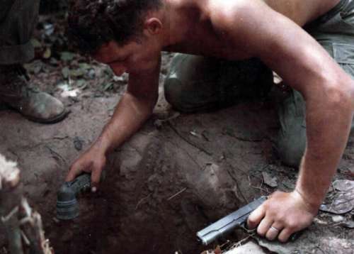 Tunnel Rat Soldier entering a Vietcong Tunnel during the Vietnam War free photo