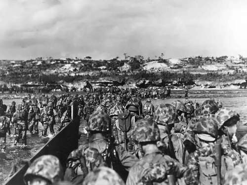 U.S. Marine reinforcements wade ashore in Okinawa, World War II free photo
