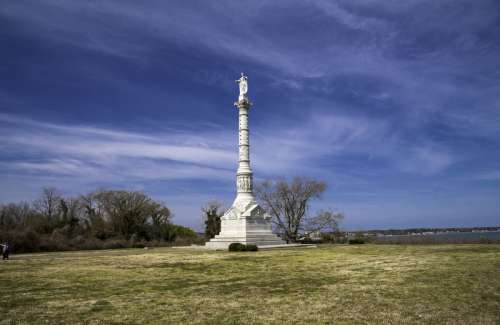 Victory Monument under blue skies in Yorktown, Virginia free photo