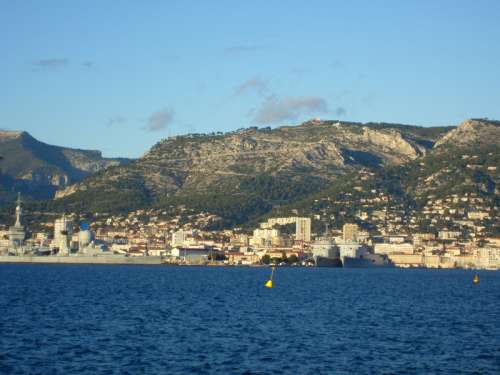 View of Toulon, the Arsenal and Mount Faron from the Harbour in France free photo