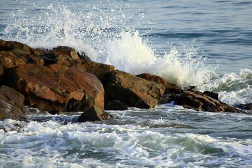 Waves crashing over the rocks in nature in Cuba free photo