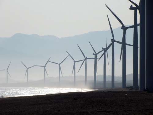 Windmill Farm on the shore in the Philippines free photo