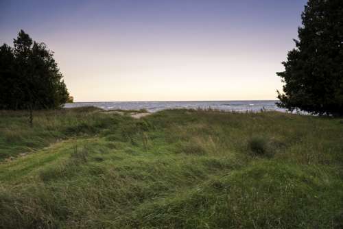 Windy Sand Dunes landscape along Lake Michigan at J.W. Wells State Park free photo