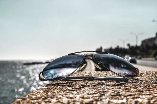 closeup of sunglasses on a wall free image