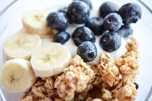 Blueberries and banana in Müsli Fitness Breakfast close up