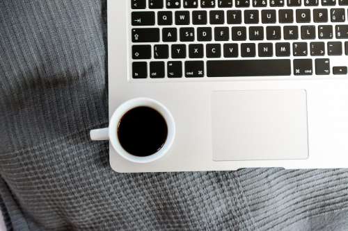 Cup off coffee on macbook