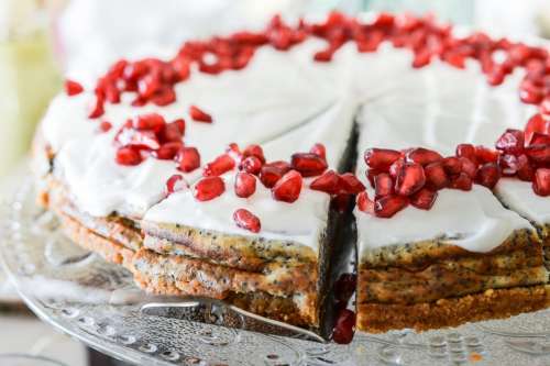 Poppy cake with pomegranate on the top