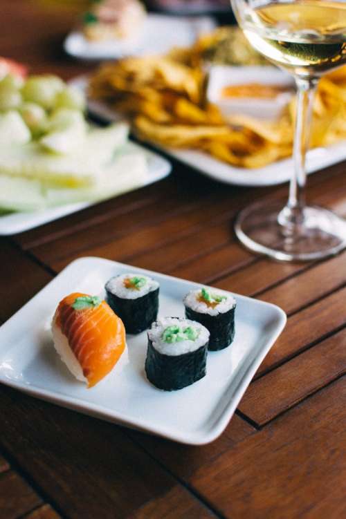 Sushi nigiri and maki with wasabi on a summer party