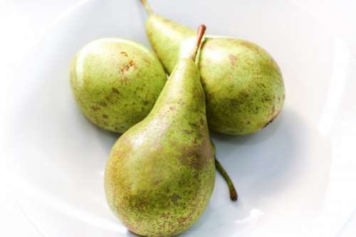 Three pears on white background