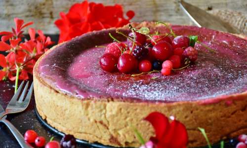 Cheesecake with cherries, raspberries and red currants