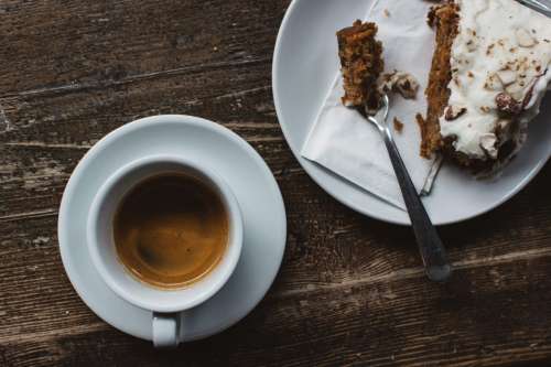 Espresso with carrot cake on a wooden table