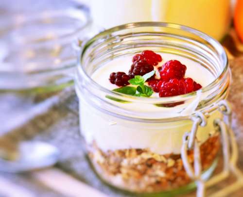 Muesli with yogurt and raspberries breakfast