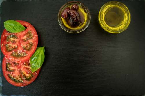 Olive Oil and Tomato Board Background