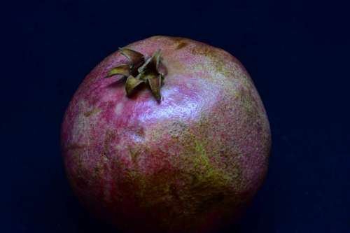 Pomegranate in dark background