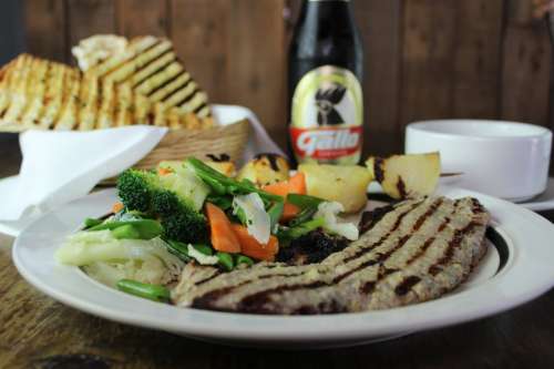 Steak with vegetables and beer